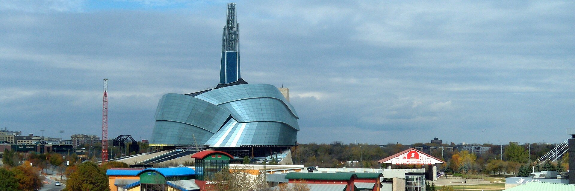 The Forks and the Canadian Museum for Human Rights rising above where the Red and Assiniboine rivers meet at golden hour