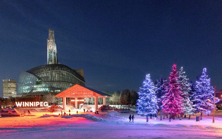 Skaters on the winter river trail at The Forks in Winnipeg